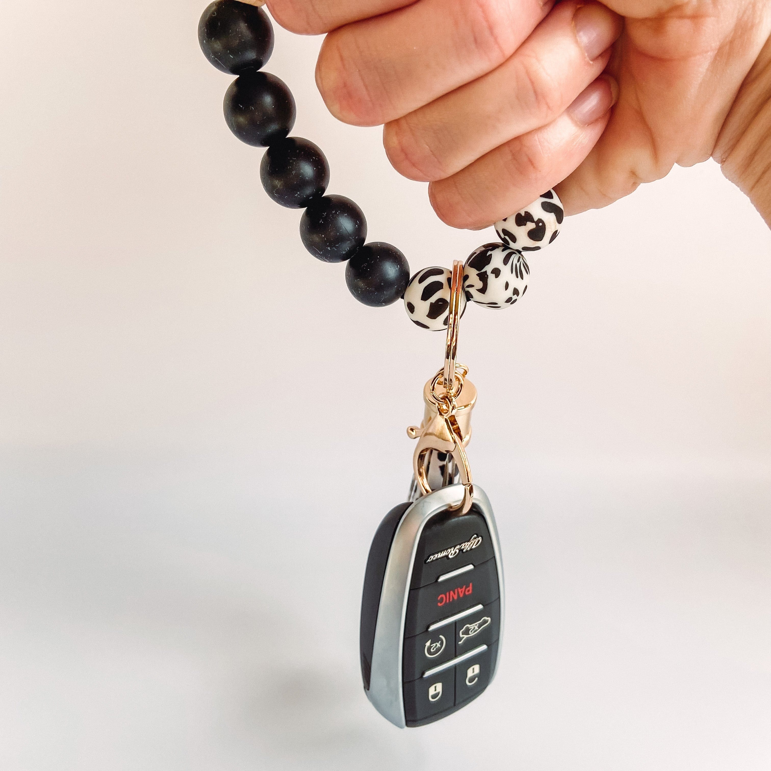 Ausbay Silicone Keychain: Womens Wristlet Key Ring Bracelet for Car Keys  with Leather Tassel (Black) at Amazon Women's Clothing store